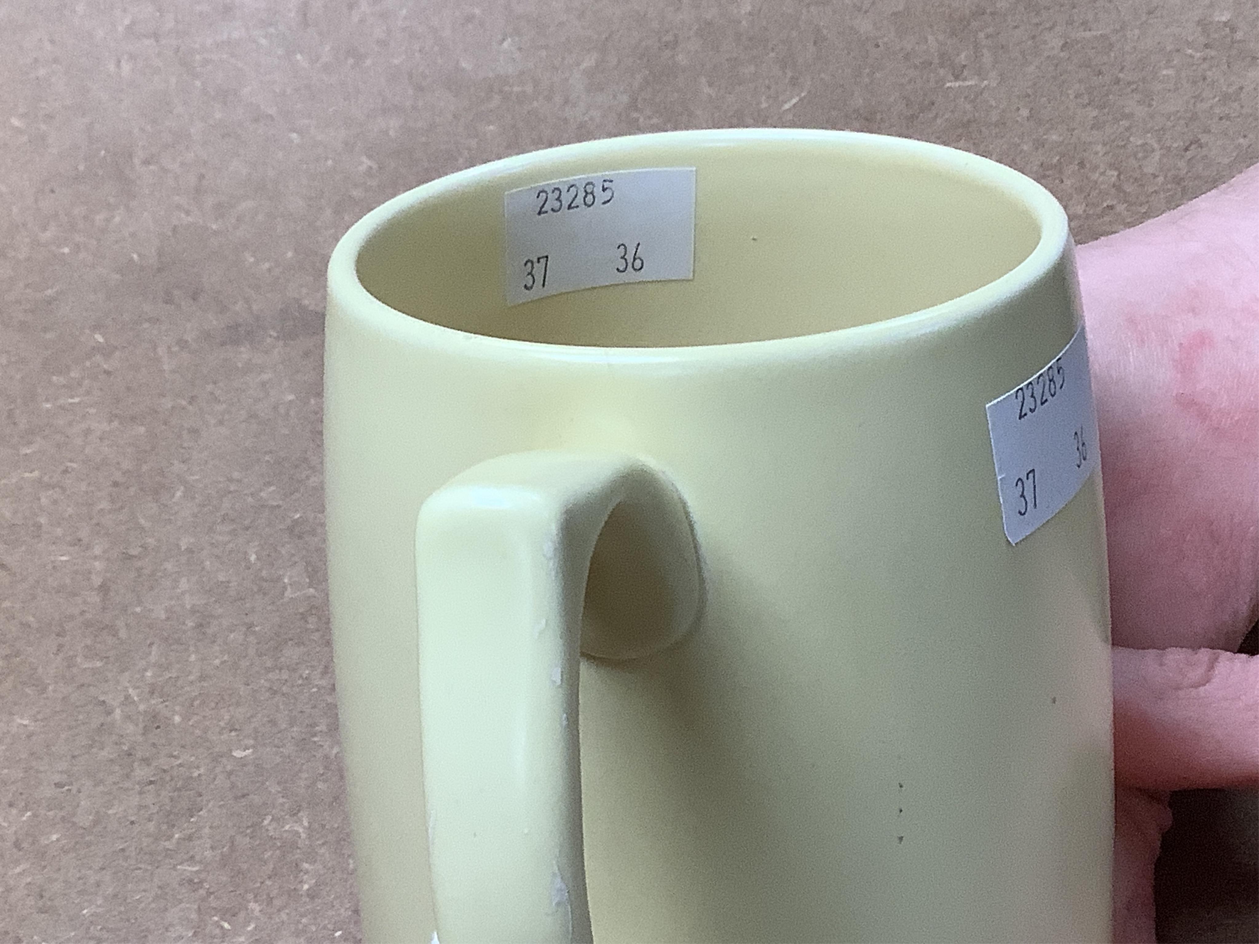 A Keith Murray Wedgwood mug in matt straw, 12cm